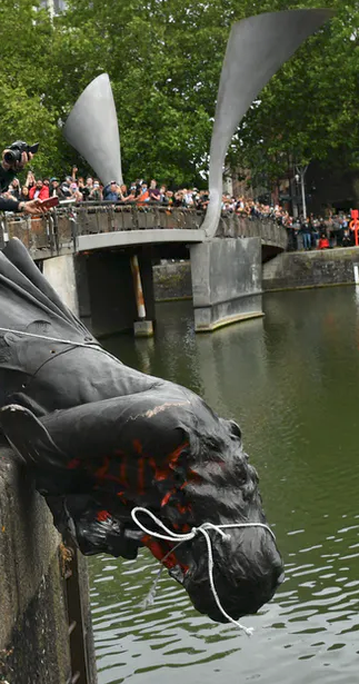 Protesters throw statue of Edward Colston into Bristol harbour. PA/Ben Birchall (cropped image)